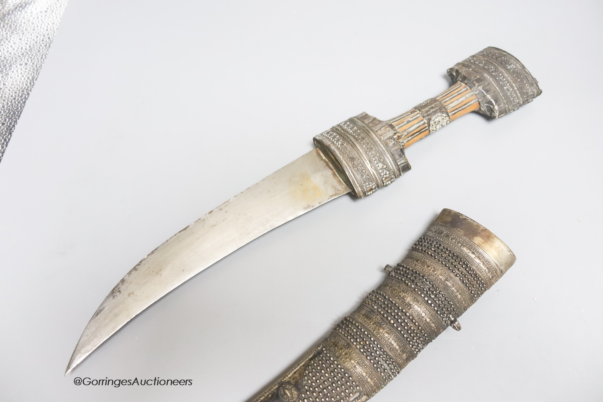 A Middle Eastern silver mounted dagger, length 51cm